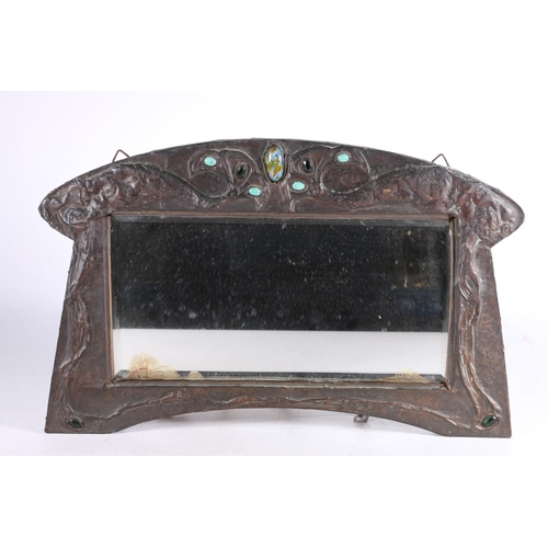 380 - Art Nouveau mirror with bevelled glass in beaten metal frame set with cabochons, 26 x 40cm.