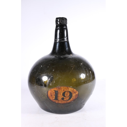 383 - Antique green glass globe and shaft type wine bottle, the onion shaped body with painted oval '19', ... 