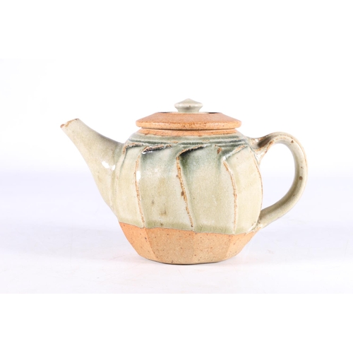 409 - RICHARD BATTERHAM (1936-2021), a cut sided studio pottery ash glazed stoneware teapot, 12cm tall, 18... 