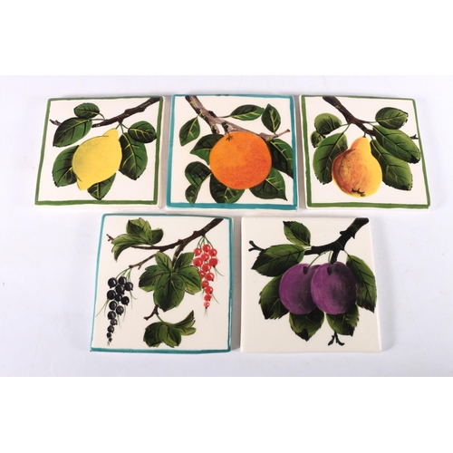 419 - Five Griselda Hill Wemyss pottery tiles of fruit design, 10cm x 10cm and a floral pattern ginger jar... 