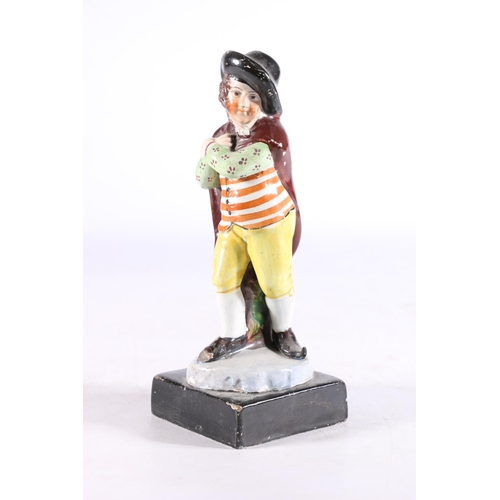 430 - Antique pottery figure modelled as a gentleman wearing a cap and cape, manner of Rathbone of Portobe... 