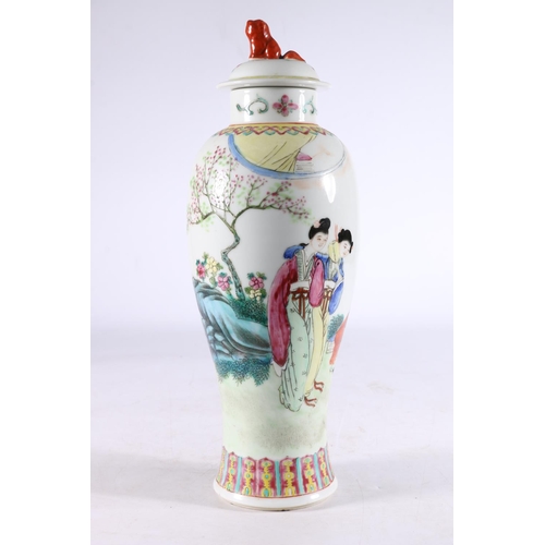 455 - Chinese porcelain temple jar and cover, the slender baluster body decorated with figures in a garden... 