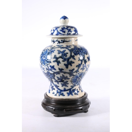 457 - Chinese blue and white pottery ginger jar and cover with double ring mark to the base, 23cm tall.