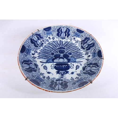 459 - Antique Dutch tin glazed blue and white charger dish, decorated with urn of flowers, painted marks t... 