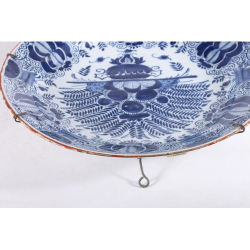 459 - Antique Dutch tin glazed blue and white charger dish, decorated with urn of flowers, painted marks t... 