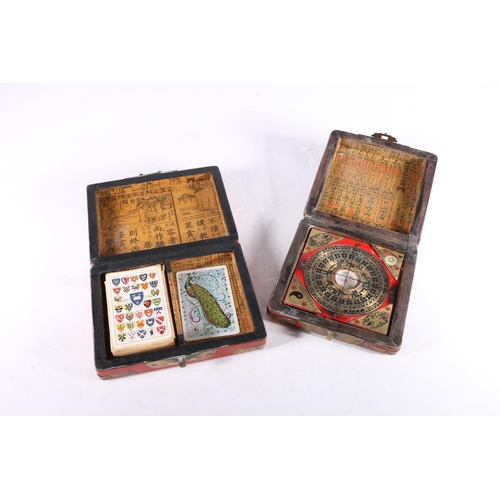 463 - Chinese painted red lacquer box with bird design containing a compass, 14cm x 14cm and a similar car... 