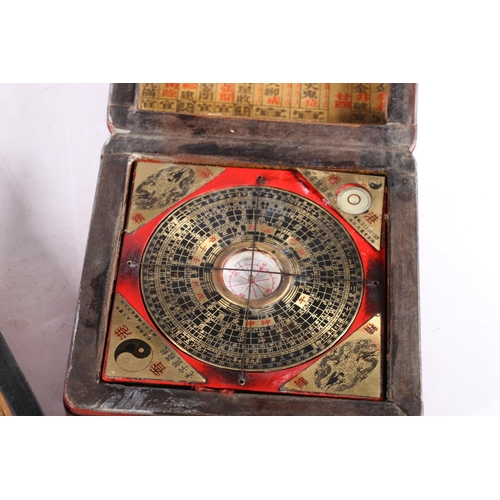 463 - Chinese painted red lacquer box with bird design containing a compass, 14cm x 14cm and a similar car... 