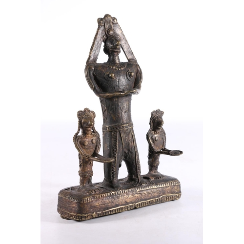 464 - African Benin style cast metal figure group the central large figure flanked by smaller figures, 21.... 