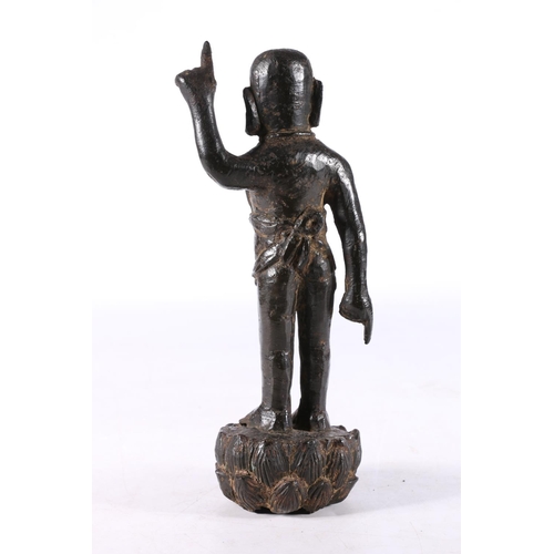 465 - Antique Chinese cast bronze figure of buddha type character moulded standing with finger raised wear... 