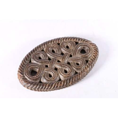 478 - Antique carved wood oval panel with continuous knot design, 19cm long.