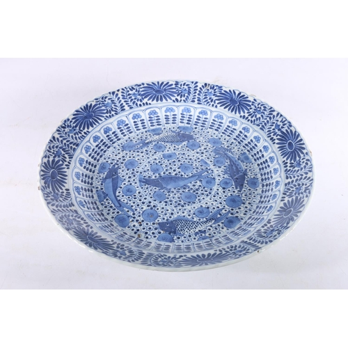 458 - Chinese blue and white porcelain charger dish decorated with fish and floral design, four character ... 