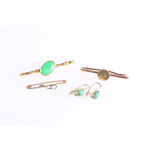 141 - Chinese gold bar brooch set with oval jade cabochon stone, 2g gross, a pair of similar earrings 1.6g... 