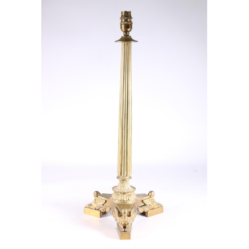 353 - Gothic style brass table lamp with reeded tapered column on platform base adorned with mythical wing... 