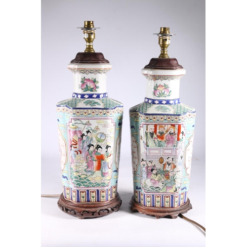 452 - Pair of Chinese Canton famille rose converted table lamps decorated with panels of polychrome five c... 