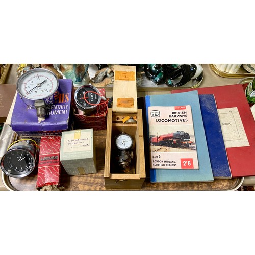 294 - Quantity of items including pressure gauge , Smiths clocks car parts, notebooks