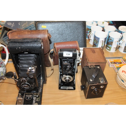 134 - Kodak 3A Autographic folding bellows camera, Kodak Junior 1 folding bellows camera and a box brownie... 