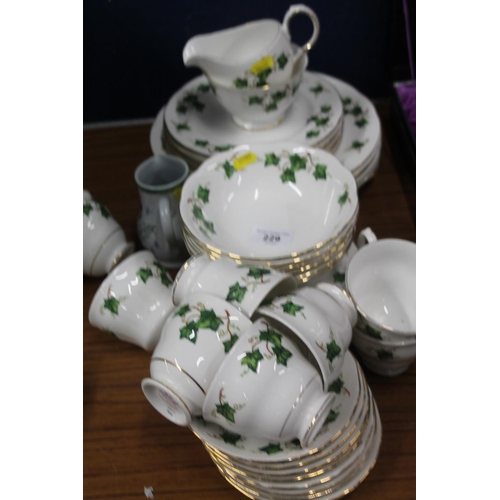 229 - Colclough china foliate decorated teaset and a Buchan cream jug.