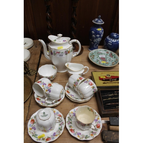 252 - Royal Crown Derby coffee set with floral decoration.