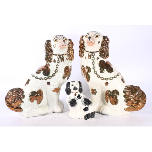 101 - Pair of Staffordshire style wally dogs and another smaller, 32cm