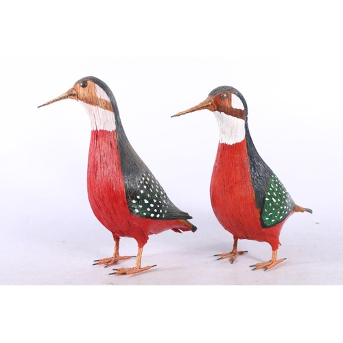 11 - Carved wooden decoy style duck, and a pair of straw models of birds.