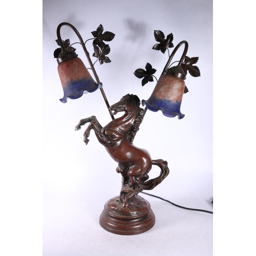 118 - Table lamp formed as a rearing horse with two mottled glass shades, 64cm.