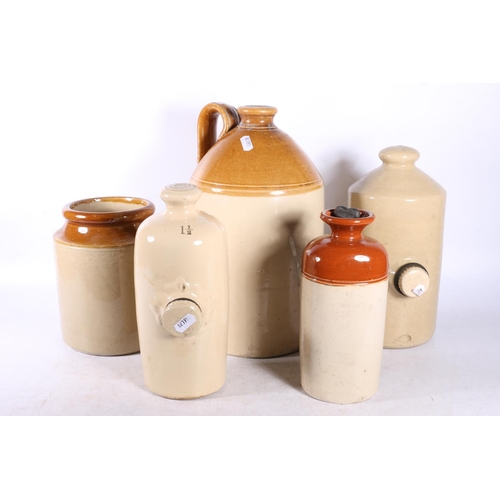 129 - Stoneware flaggon, three stoneware hot water bottles and a storage jar, (5).