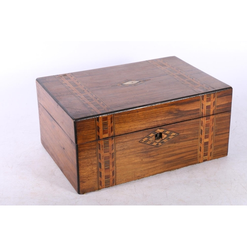 130 - Mother of pearl inlaid Turnbridge ware box, 25cm wide.