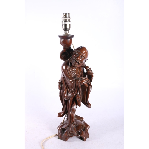 150 - Oriental table lamp in the form of a fisherman, 43cm.