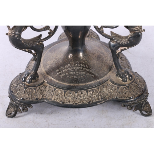 34 - Edwardian table centrepiece, raised on three gryphons.