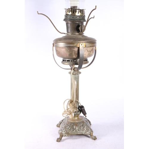 52 - Converted oil lamp, marked Aladdin, on pierced base with paw feet, 75cm to top of shade.