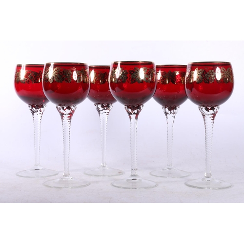 77 - Six ruby glass hock glasses decorated with gold printed grape & vine design.