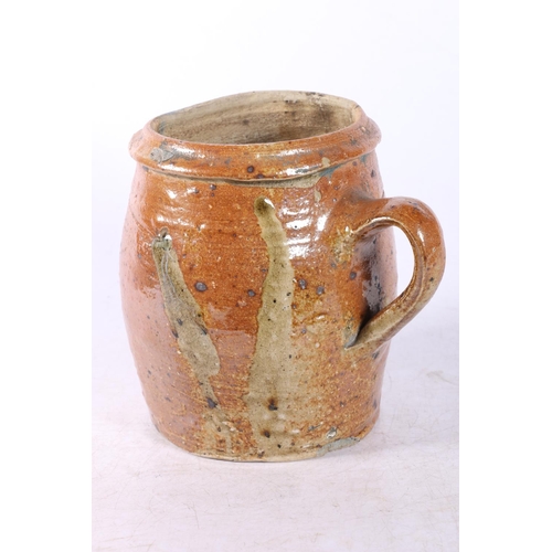 82 - Terracotta tankard, and a French slipware style jug.  (2)