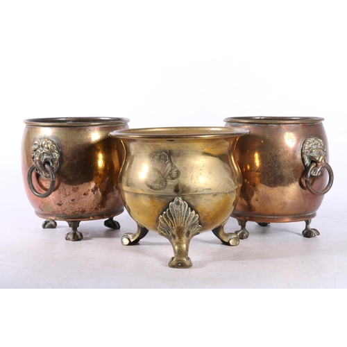 83 - Four brass candlesticks, and three small brass pots.