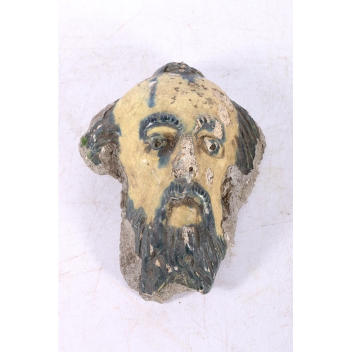 91 - Antique glazed face plaque of a bearded gentleman, 11cm.