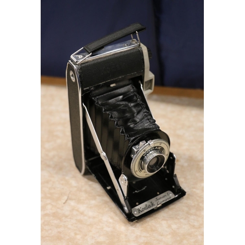 134 - Kodak 3A Autographic folding bellows camera, Kodak Junior 1 folding bellows camera and a box brownie... 