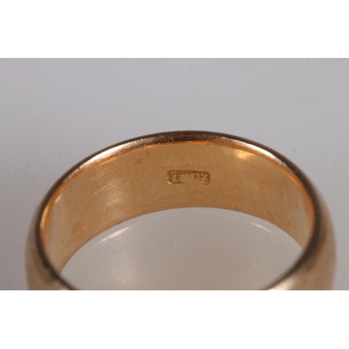 107 - 18ct gold plain wedding band, stamped '18ct', ring size N, 7.3g.