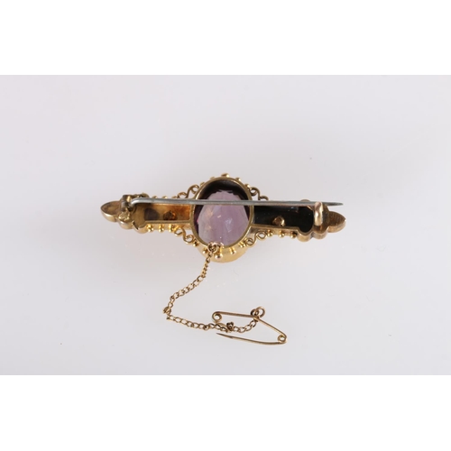 113 - Victorian yellow metal brooch set with large faceted oval amethyst and seed pearls, no markings, 9.8... 