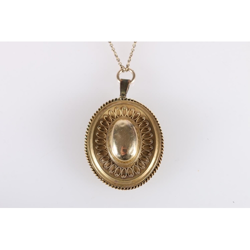 116 - Victorian yellow metal oval mourning pendant with filigree work decoration on a a fancy link neck ch... 