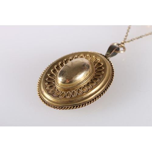 116 - Victorian yellow metal oval mourning pendant with filigree work decoration on a a fancy link neck ch... 