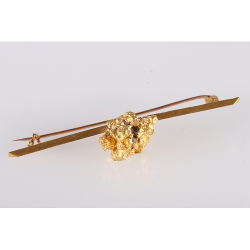 124 - Raw gold nugget set onto a knife edge bar brooch, unhallmarked, 16.2g gross and another smaller, 1g.... 