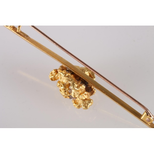 124 - Raw gold nugget set onto a knife edge bar brooch, unhallmarked, 16.2g gross and another smaller, 1g.... 