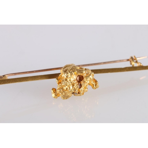 124 - Raw gold nugget set onto a knife edge bar brooch, unhallmarked, 16.2g gross and another smaller, 1g.... 