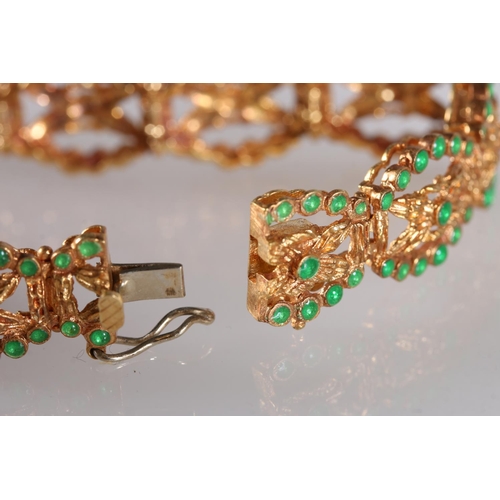 128 - 18ct yellow gold bracelet set with emerald green cabochon stones, the clasp stamped '750', 25.2g gro... 