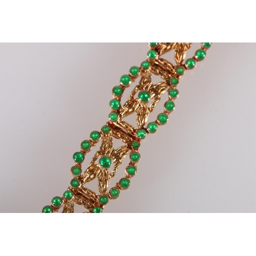 128 - 18ct yellow gold bracelet set with emerald green cabochon stones, the clasp stamped '750', 25.2g gro... 