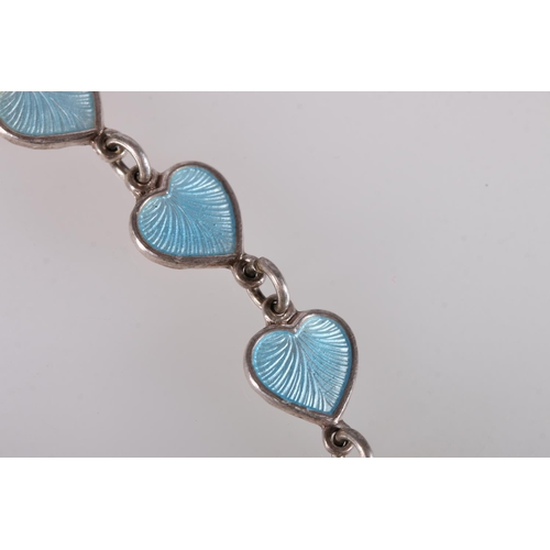 130 - Volmer Bahner of Denmark, a Danish silver and enamel heart link bracelet, 8g gross.