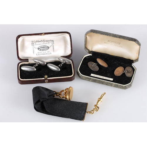 135 - Rolled gold fob on black ribbon suspender, 11.6g gross, a pair of gold-plated silver cufflinks and a... 