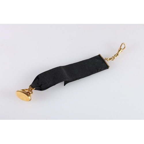 135 - Rolled gold fob on black ribbon suspender, 11.6g gross, a pair of gold-plated silver cufflinks and a... 