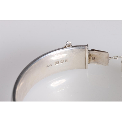 148 - Georg Jensen hinged bangle with foliate decoration to one side hallmarked GJLd, london 1964, 6cm, 24... 