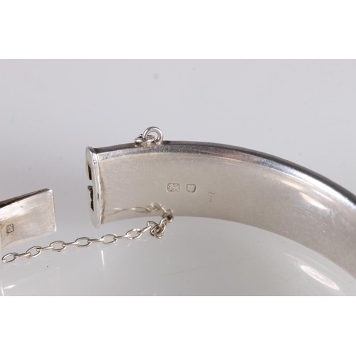 148 - Georg Jensen hinged bangle with foliate decoration to one side hallmarked GJLd, london 1964, 6cm, 24... 