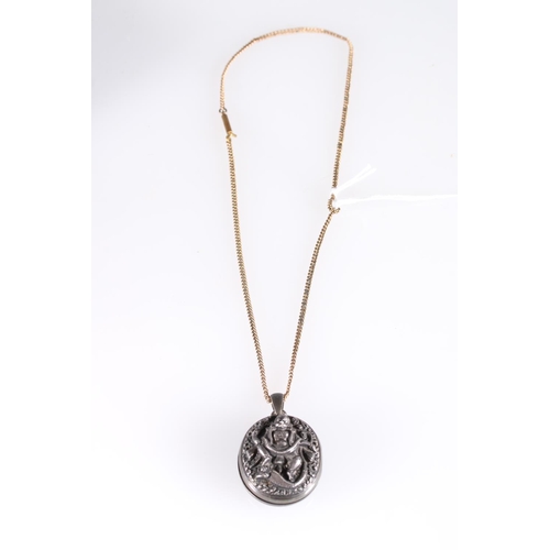 149 - Late 19th early 20th century white metal locket with deity entwined by serpent to front, 3.5cm. ... 